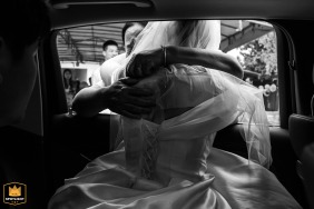 The bride’s mother embraces her daughter through the car window while saying goodbye outside the family home in Jiujiang City, Jiangxi Province, China